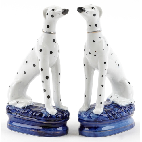 2458 - Pair of Staffordshire pottery Dalmatians, each 22cm high