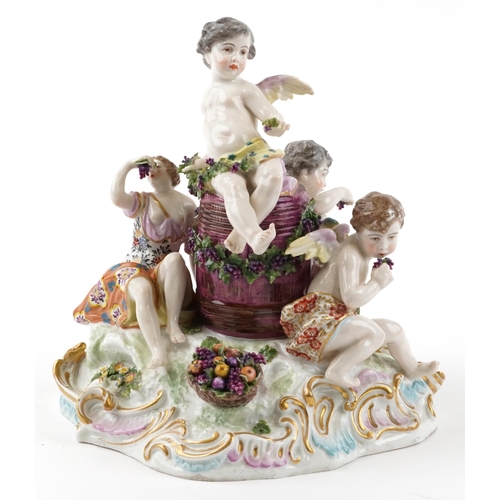 243 - Manner of Meissen, 19th century porcelain 'Vintner' centrepiece modelled in the form of three Putti ... 