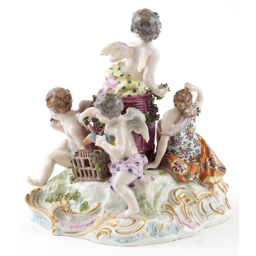 243 - Manner of Meissen, 19th century porcelain 'Vintner' centrepiece modelled in the form of three Putti ... 