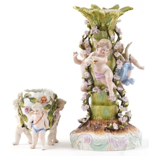 248 - Plaue, German floral encrusted porcelain centrepiece surmounted with three Putti and a similar flora... 