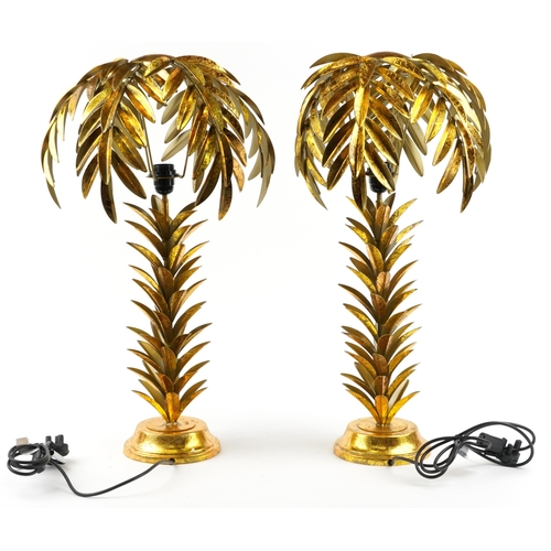 175 - Pair of Hollywood Regency style gilt painted table lamps in the form of palm trees, each 75cm high