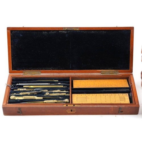 2481 - 19th century mahogany cased drawing set housing various brass implements and boxwood rules together ... 