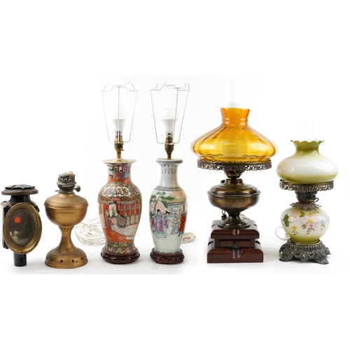 2542 - Six lamps including a Chinese porcelain example hand painted in the famille rose palette, carriage l... 