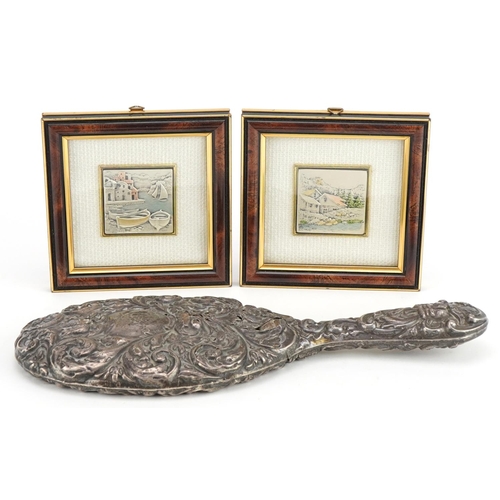 2487 - Pair of Cadeor Italian silver plaques housed in glazed frames and a silver backed hand mirror profus... 