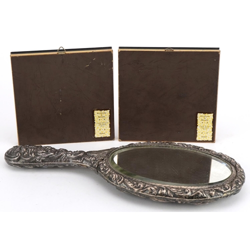 2487 - Pair of Cadeor Italian silver plaques housed in glazed frames and a silver backed hand mirror profus... 