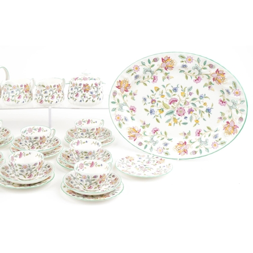 2317 - Minton Haddon Hall dinner and teaware including teapot, large oval platter, trios and dinner plates,... 