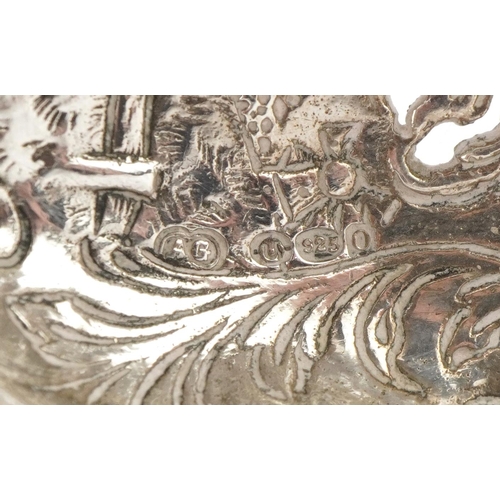 324 - Dutch silver sifting spoon, the bowl embossed with a young farm girl with mermaid and rigged sailing... 