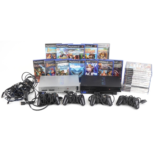 1213 - Two Sony PlayStation 2 games consoles with controllers and various games including League of Speed, ... 