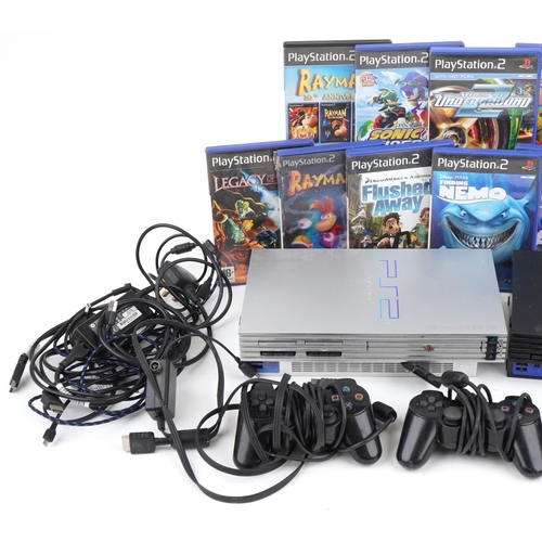 1213 - Two Sony PlayStation 2 games consoles with controllers and various games including League of Speed, ... 