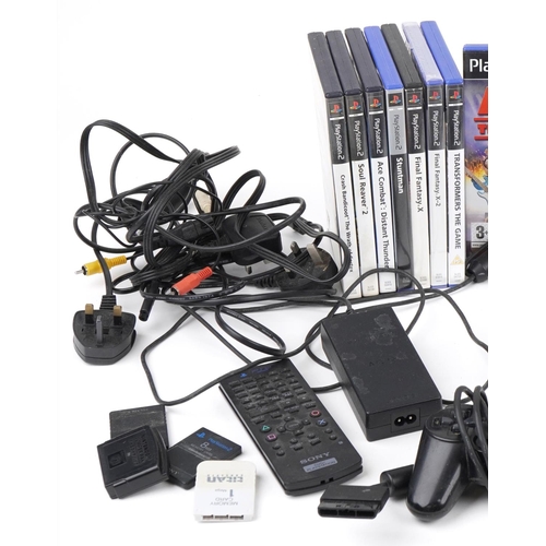 1217 - Two Sony PlayStation 2 games consoles with controllers and various games including Spiro and Grand T... 