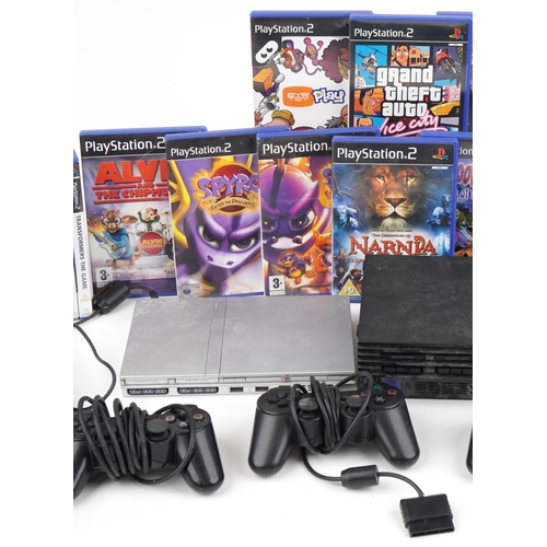 1217 - Two Sony PlayStation 2 games consoles with controllers and various games including Spiro and Grand T... 