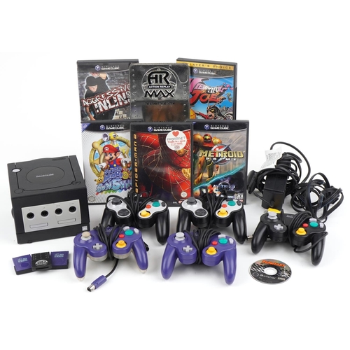 1210 - Vintage Nintendo Game Cube games console with controllers and various games including Super Mario an... 