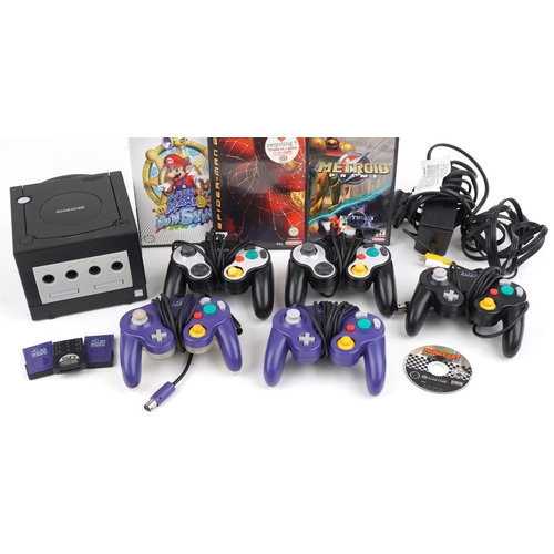 1210 - Vintage Nintendo Game Cube games console with controllers and various games including Super Mario an... 