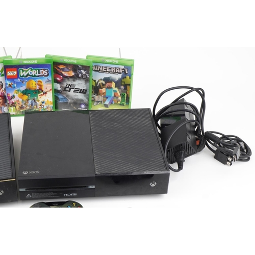 1211 - Two Microsoft Xbox 1 games consoles with various controllers and games including Worms and Minecraft