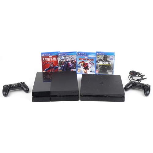 1216 - Two Sony PlayStation 4 games consoles with two controllers and various games including Call of Duty