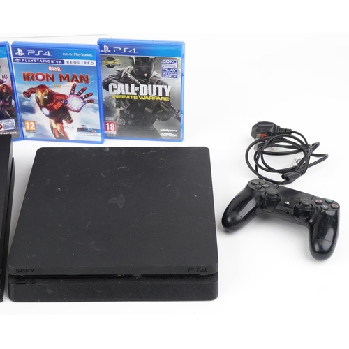 1216 - Two Sony PlayStation 4 games consoles with two controllers and various games including Call of Duty