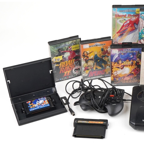 1224 - Vintage Sega Mega Drive 16 bit games console with two controllers and various games including Sonic ... 