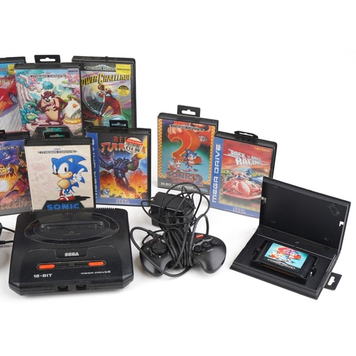 1224 - Vintage Sega Mega Drive 16 bit games console with two controllers and various games including Sonic ... 