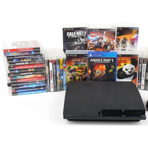 1215 - Sony PlayStation 3 games console with controller and a collection of games