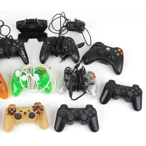 1223 - Various games console controllers including Sony PlayStation and Microsoft Xbox