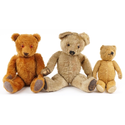 1151 - Three antique and later golden teddy bears with joined limbs including two straw filled examples, on... 