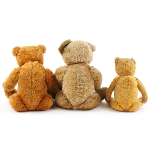 1151 - Three antique and later golden teddy bears with joined limbs including two straw filled examples, on... 