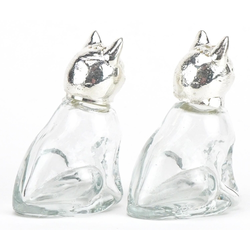 2475 - Pair of novelty glass salt and pepper casters with silver plated heads in the form of cats, 7cm high