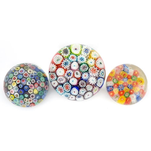 2307 - Three 20th century millefiori glass paperweights, the largest 7cm high