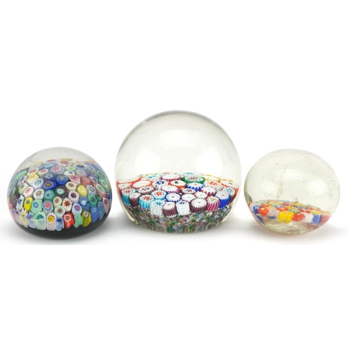 2307 - Three 20th century millefiori glass paperweights, the largest 7cm high