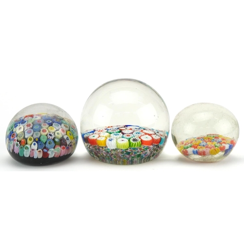 2307 - Three 20th century millefiori glass paperweights, the largest 7cm high