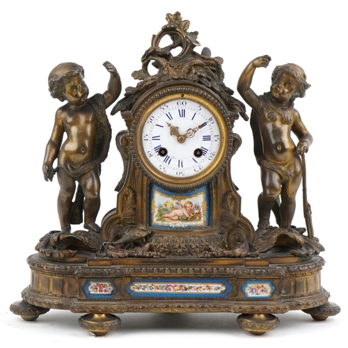 Deprez of Paris, 19th century French ormolu mantle clock striking on a bell with circular dial and Sevres type panels surmounted with putti, the circular dial having Roman and Arabic Numerals,  32cm wide