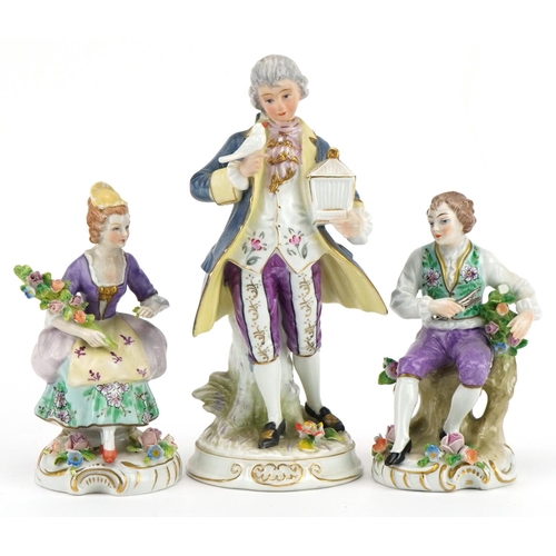 249 - Three continental porcelain figures including a pair of German floral encrusted flower sellers by Si... 