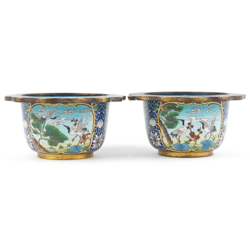 27 - Good pair of Chinese cloisonne planters enamelled with panels of cranes within a border of flowers, ... 