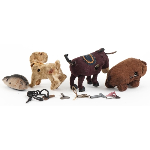 1171 - Four early 20th century clockwork animals including a Schuco mouse, bear with Made in Japan label an... 