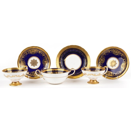 349 - Aynsley Kenilworth cobalt blue ground soup cup with saucer and two similar teacups with saucers, eac... 