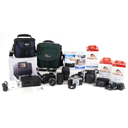 1065 - Vintage and later cameras and accessories, some with boxes including Nikon F65, Canon Selphy CPA100,... 