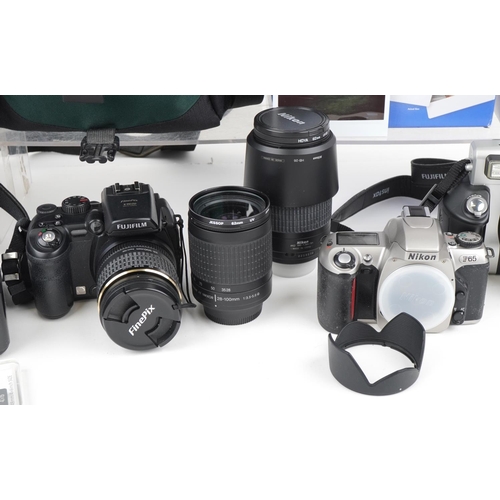 1065 - Vintage and later cameras and accessories, some with boxes including Nikon F65, Canon Selphy CPA100,... 