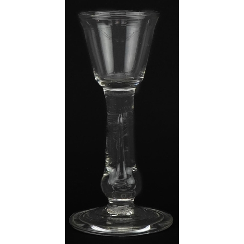 54 - 18th century wine glass with enclosed teardrop stem on folded foot, 15.5cm high