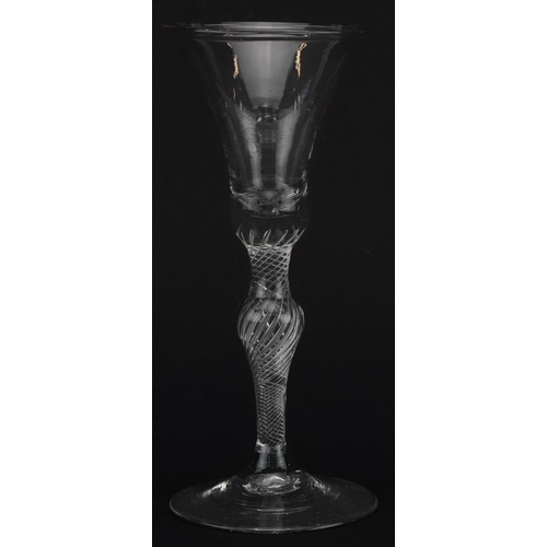 262 - 18th century wine glass with air twist stem and bell shaped bowl, 17.5cm high