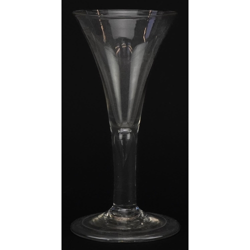 517 - 18th century wine glass with teardrop stem on folded foot, 16cm high