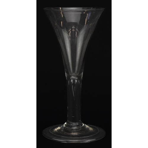 517 - 18th century wine glass with teardrop stem on folded foot, 16cm high