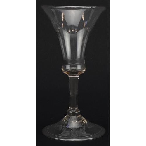 516 - 18th century wine glass with bell shaped bowl on folded foot, 15cm high