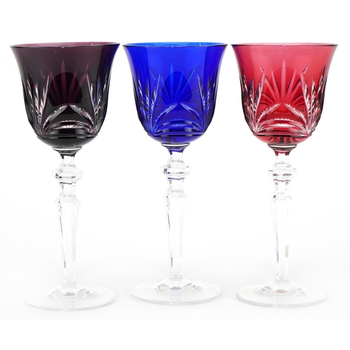 2299 - Three good quality Bohemian overlaid wine glasses, 21.5cm high