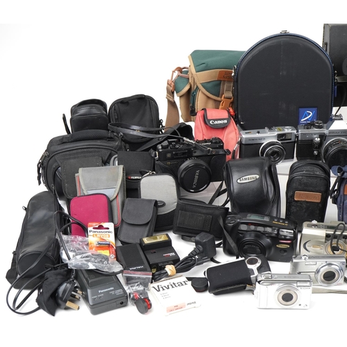 1058 - Vintage and later cameras and accessories including Praktica MTL5B, Lumix, Minolta, Canon AE-1 and F... 