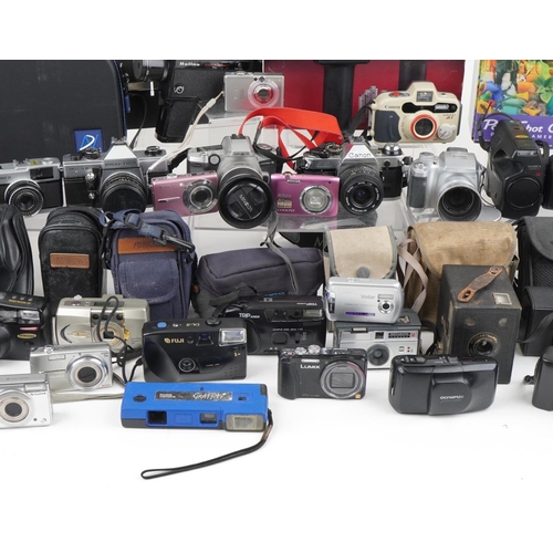 1058 - Vintage and later cameras and accessories including Praktica MTL5B, Lumix, Minolta, Canon AE-1 and F... 