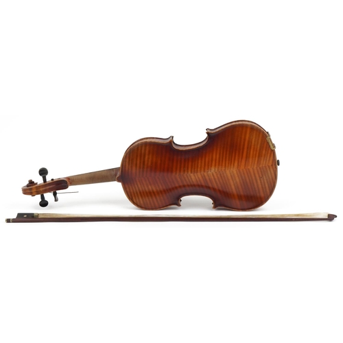 1013 - Old wooden violin with violin bow and case, the violin bearing an Antonio Stradivarius label, the vi... 