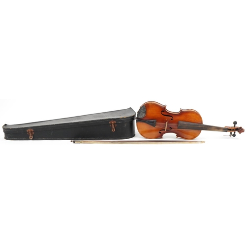 1013 - Old wooden violin with violin bow and case, the violin bearing an Antonio Stradivarius label, the vi... 