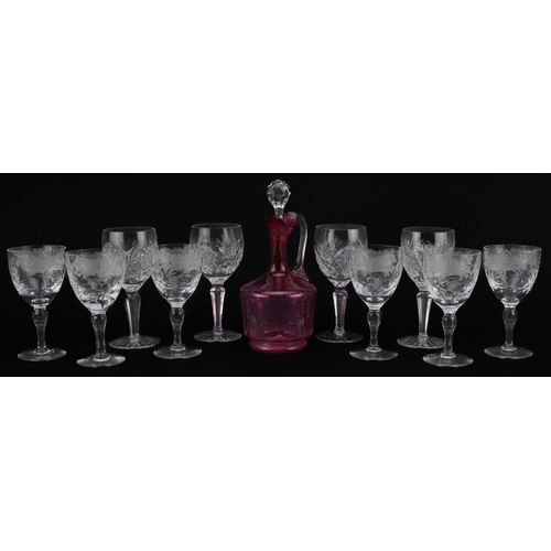 2296 - Cut glassware including set of six good quality wine glasses etched with flowers and a cranberry gla... 