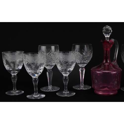 2296 - Cut glassware including set of six good quality wine glasses etched with flowers and a cranberry gla... 