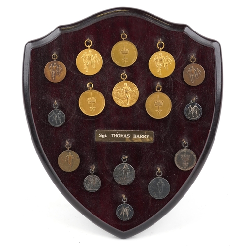 1404 - Collection of military interest athletics medals relating to Sergeant Thomas Barry arranged in a mah... 